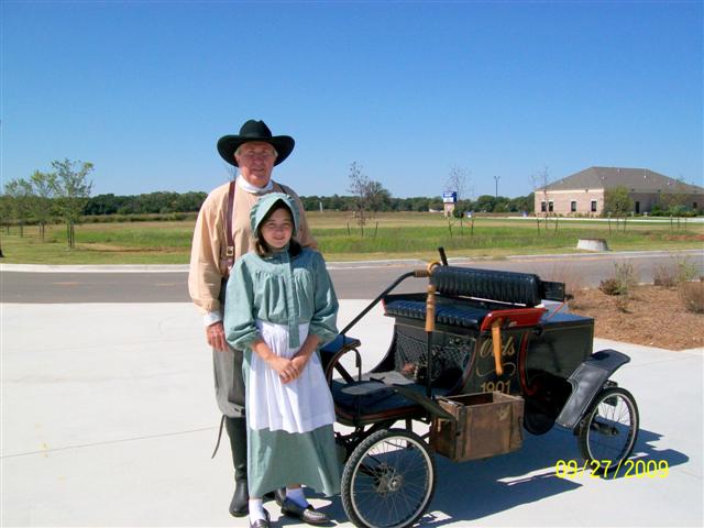 Elvis Howell and Granddaughter with 1901 Olds